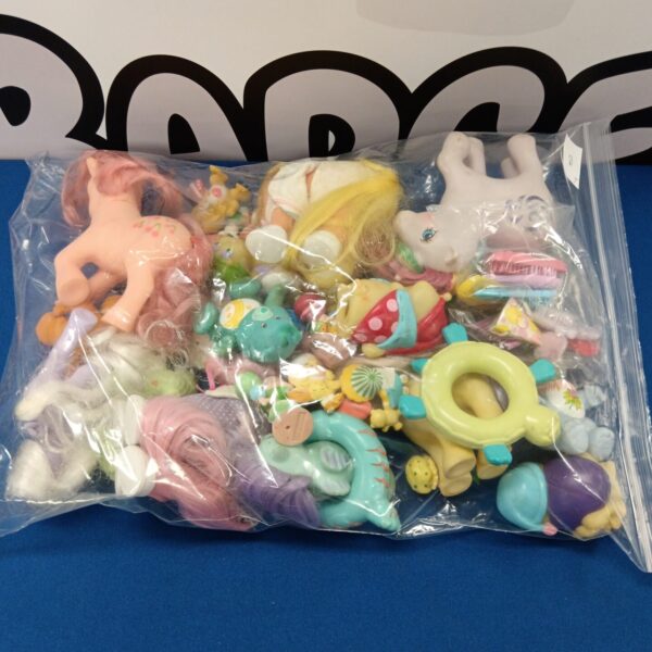 Vintage My Little Pony and Care Bears toy lot from the 1980s.