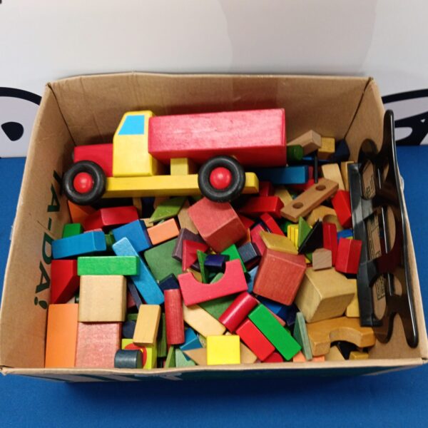 Colourful wooden building bricks and a truck for children's play.