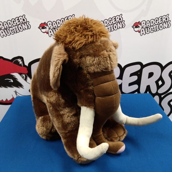Large woolly mammoth plush toy with tusks.