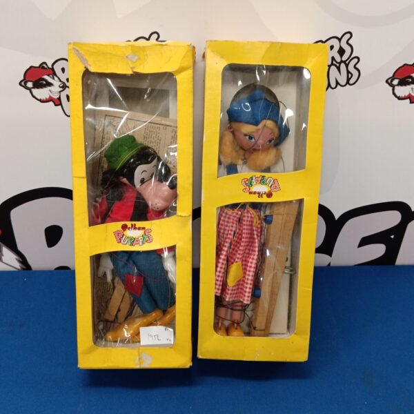 Vintage Pelham puppets including a Goofy character, collectible toys.