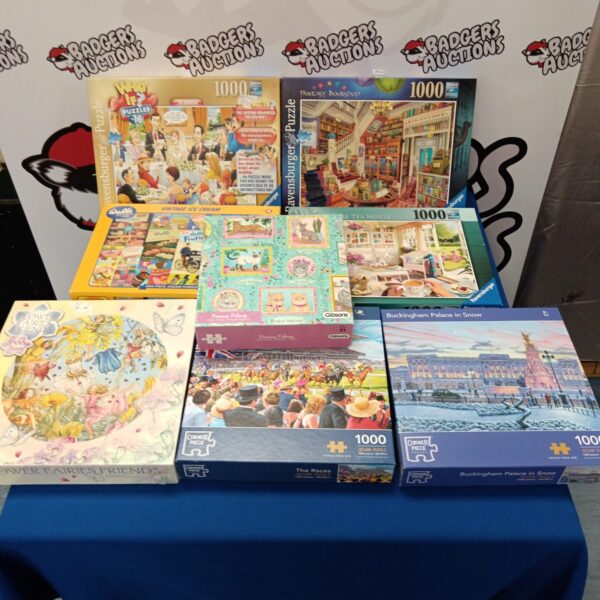 Lot of eight jigsaw puzzles including Ravensburger and corner piece.