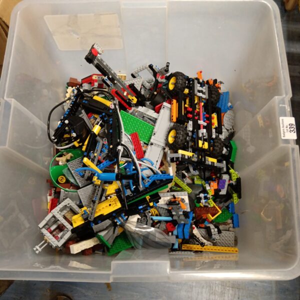 Large lot of Lego Technic parts in a clear storage box.