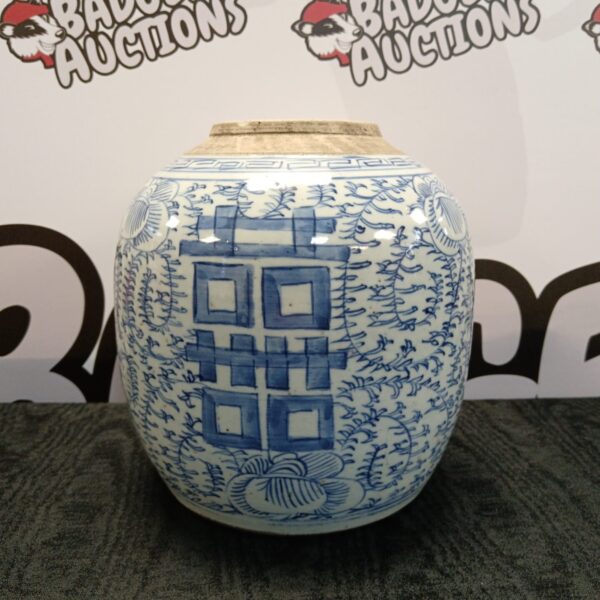 Antique Qing Dynasty blue and white porcelain vase with intricate designs.