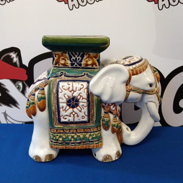 Colourful ceramic elephant pot stand for home decor.