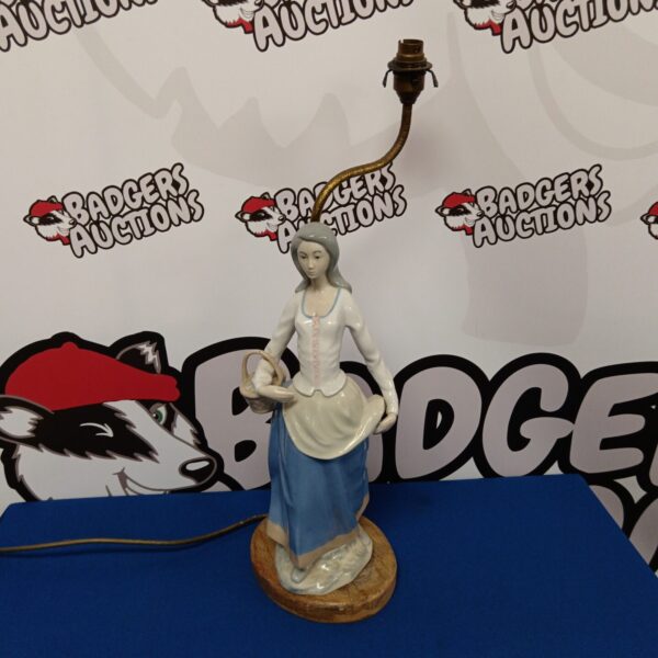 Vintage Rex porcelain table lamp with peasant girl figurine.