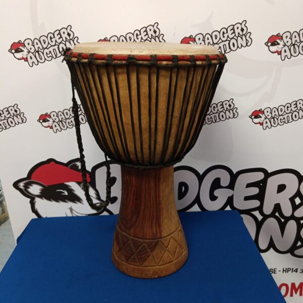 Large African bongo drum with traditional wood construction.