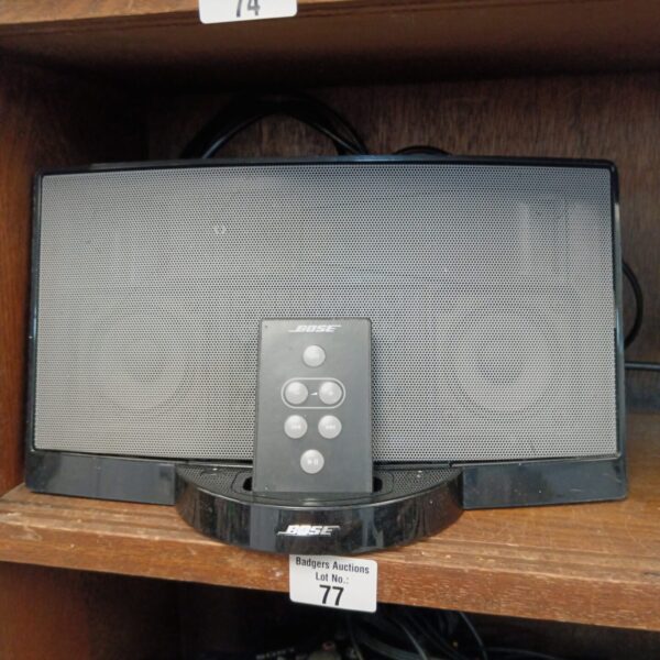 Black Bose SoundDock speaker system with remote control.