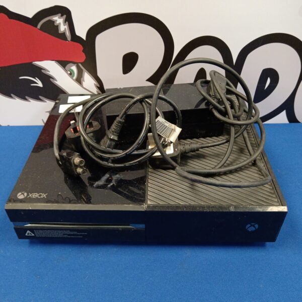 Black Microsoft Xbox One gaming console with power cable.