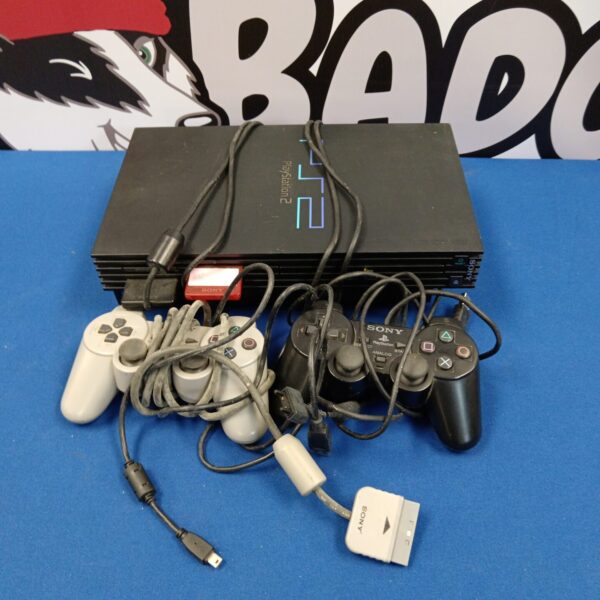 Black Sony Playstation 2 console with controller and cables.
