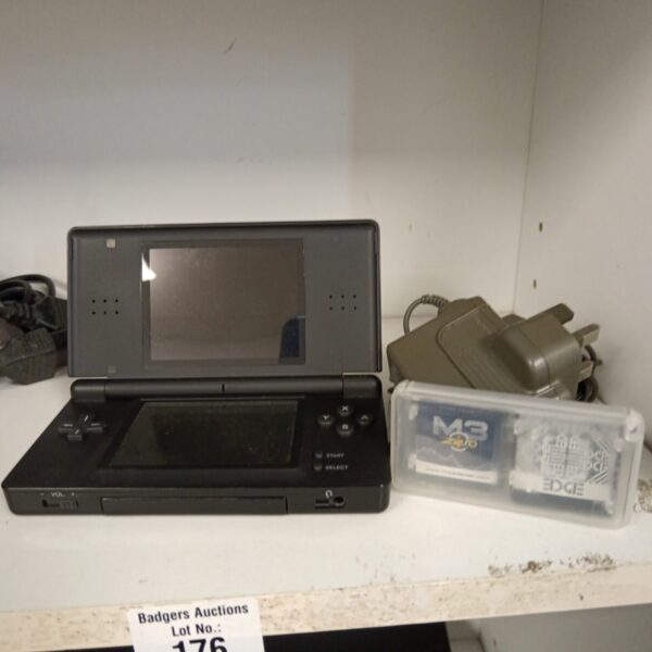 Black Nintendo DS Lite console with power supply and case.