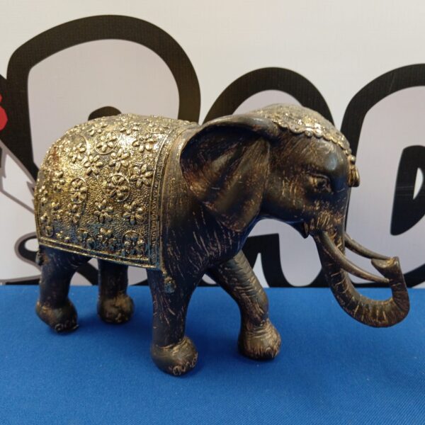 Detailed resin African elephant ornament with intricate patterns.