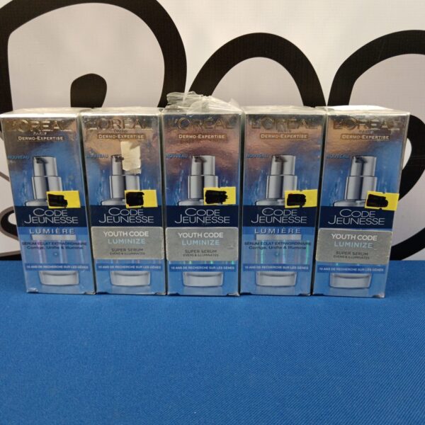 Sealed set of five L'Oréal Code Jeunesse Super Serum bottles.