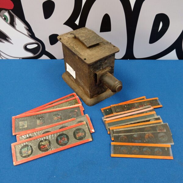 Antique magic lantern with Victorian slides, a collectible optical toy.