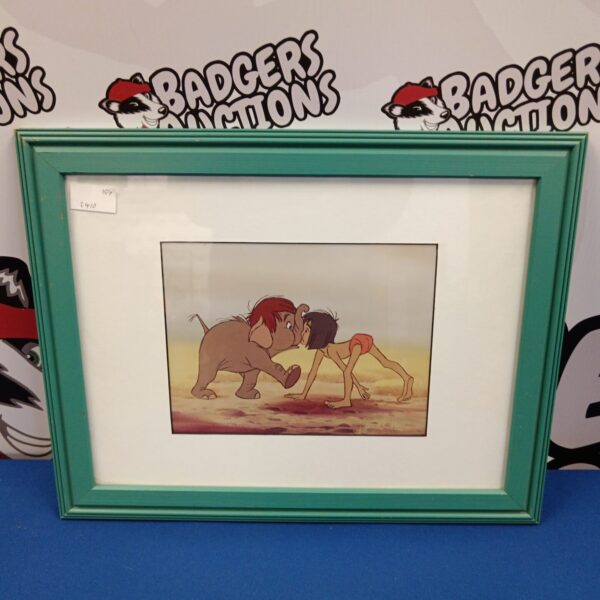 Framed vintage Disney Jungle Book Mowgli print for wall decor.