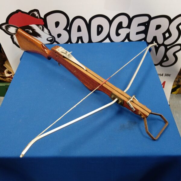 Vintage wooden crossbow, a classic antique archery weapon.