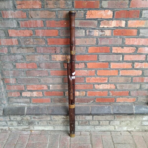 Antique bassoon, a vintage woodwind instrument awaiting restoration.