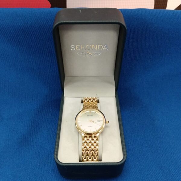Gold tone Sekonda gents watch presented for auction.