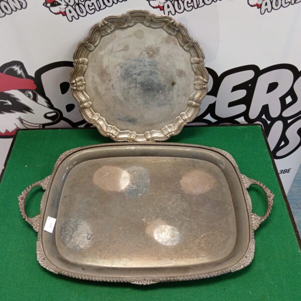 Ornate vintage silver plate serving tray with decorative handles.