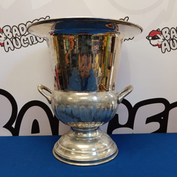 Side view of Sophie Conran silver plate wine cooler urn with handles.