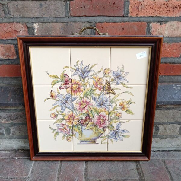 Vintage framed floral tile panel with roses and a butterfly.