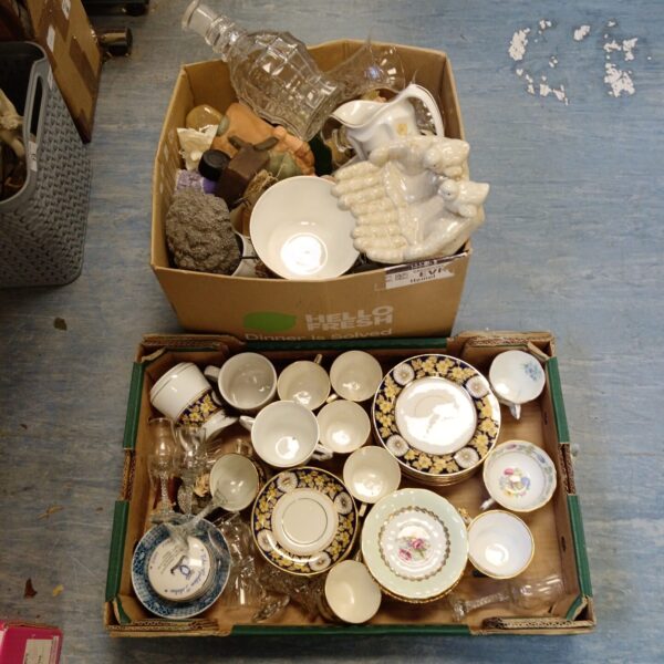 Mixed china and glass lot with teacups and saucers.
