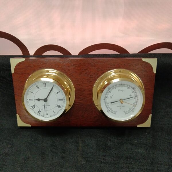 Antique Comitti barometer clock with brass casing and wooden back.