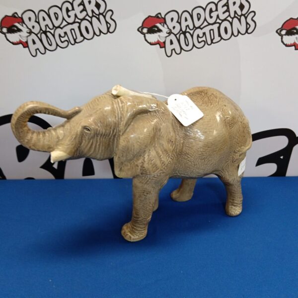 Vintage Sylvac African elephant figurine with broken tusks.