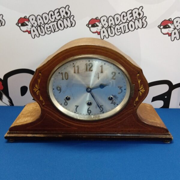 Antique Edwardian mantle clock by Bravingtons Ltd with decorative casing.