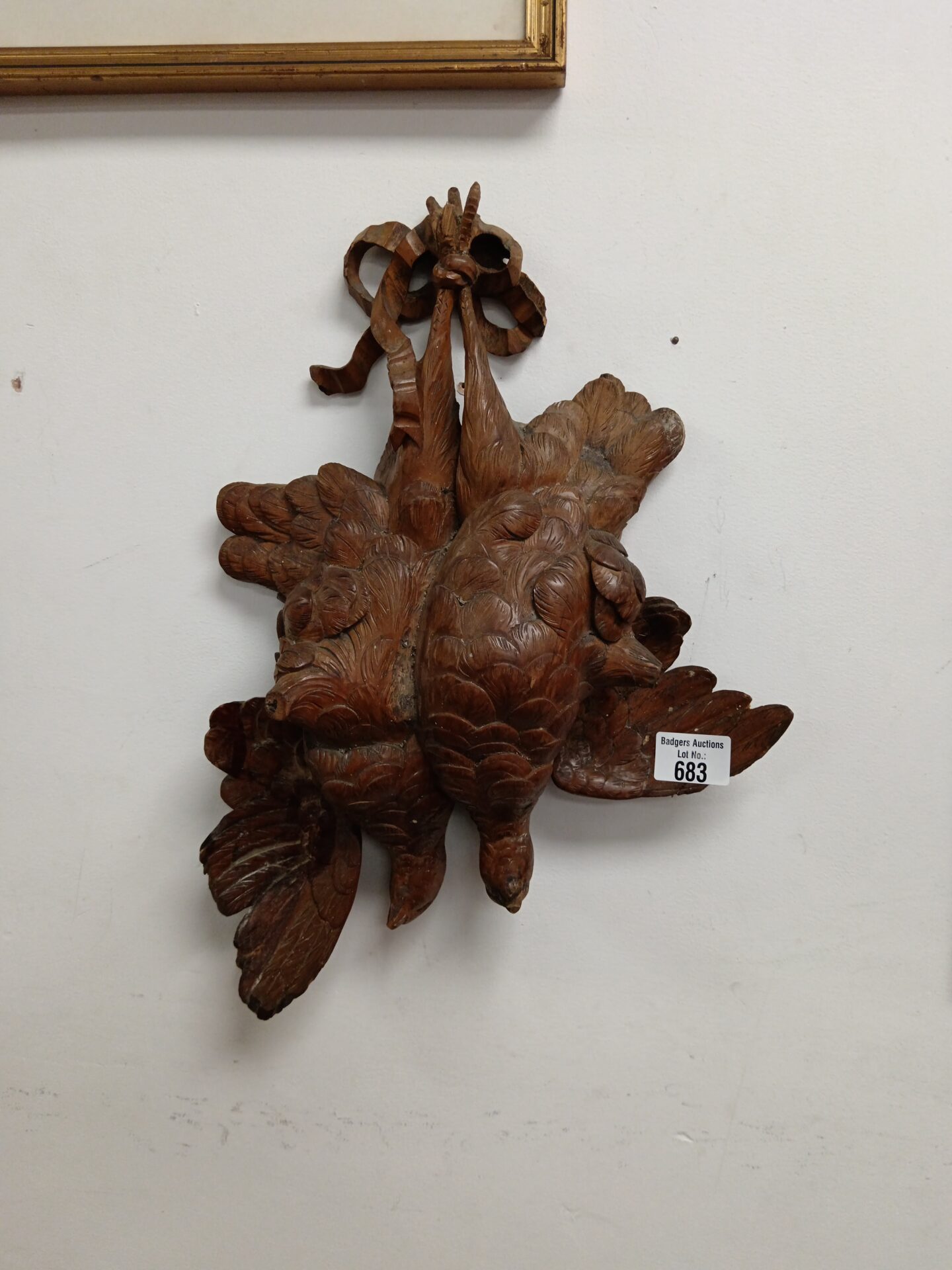 683 Brace of black forest carved wooden pheasants