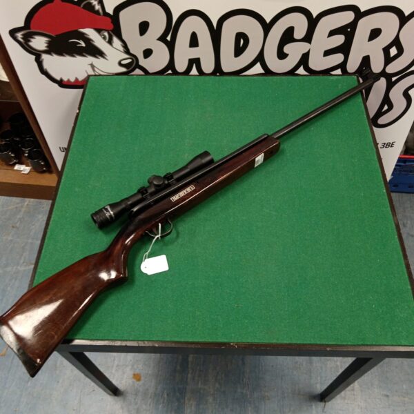 Vintage Webley Osprey .22 air rifle with scope, side view.