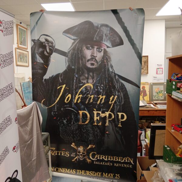 Large Pirates of the Caribbean poster featuring Johnny Depp as Captain Jack Sparrow.