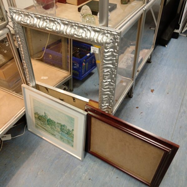 Assorted picture frames and a silver mirror in a bundle.