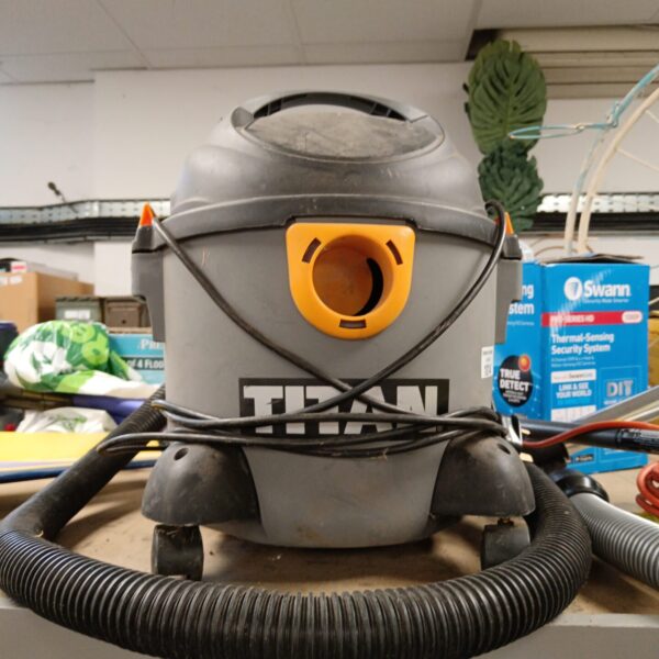 Used Titan wet dry vacuum cleaner with hose attached.