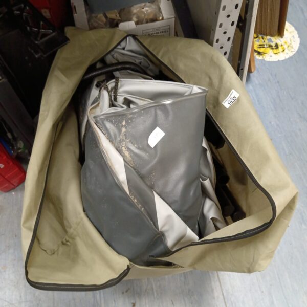 Used Intex inflatable dinghy stored inside a protective cover.