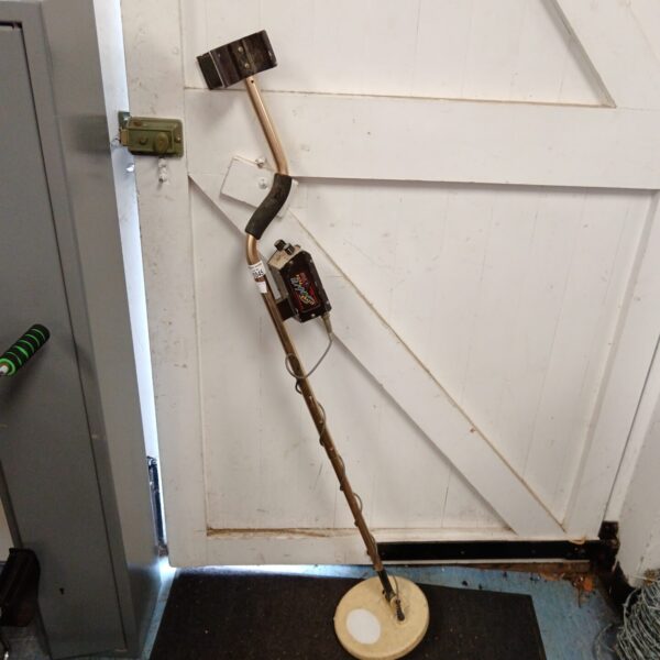 Used Bounty Hunter metal detector with circular search coil.