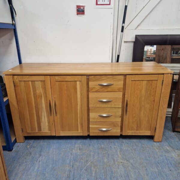 Rustic pine sideboard for farmhouse style dining room storage.
