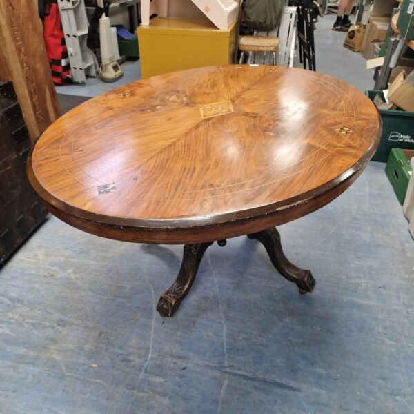 Antique mahogany tilt top table with tripod legs.