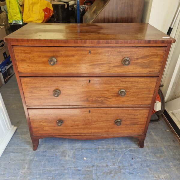 Antique mahogany chest of drawers with three drawers.