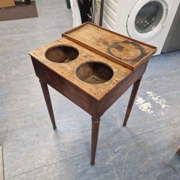 Antique cherry shaving table with two mug recesses.