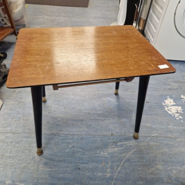 Vintage wooden coffee table with tapered legs.