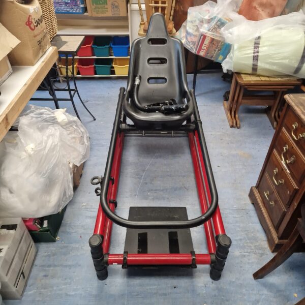 Black racing seat frame for sim racing setup.