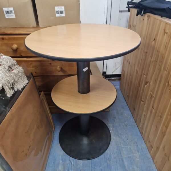 Black metal base of a two-tier round table.