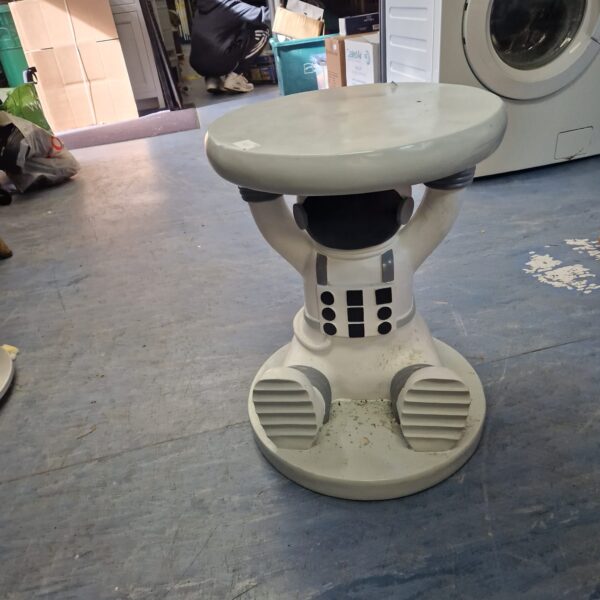 Vintage spaceman side table with a spherical body and tapered legs.