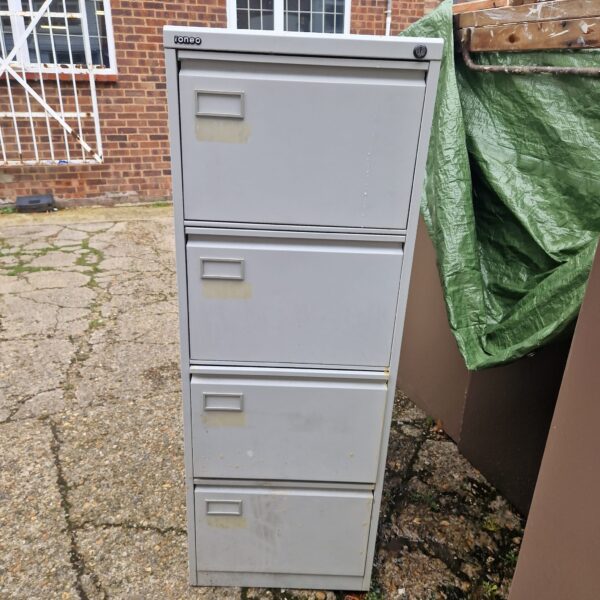 Vintage Ioneo metal filing cabinet with four drawers.