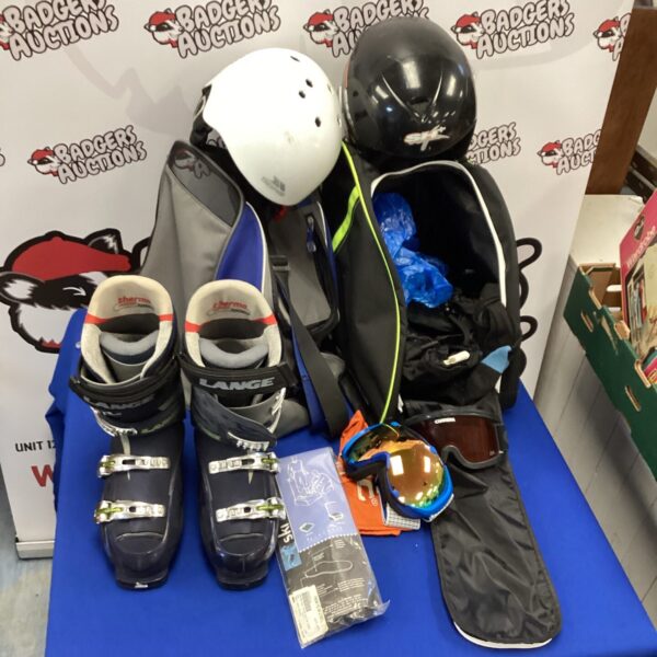 Ski equipment lot featuring boots and helmet for winter sports.