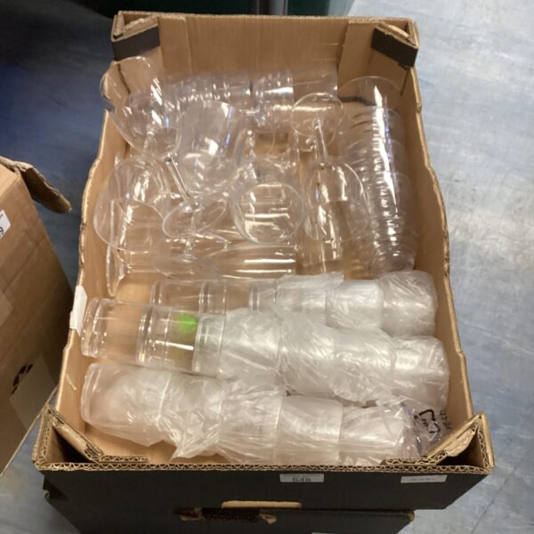 Mixed lot of glassware and plastic containers for kitchen storage.