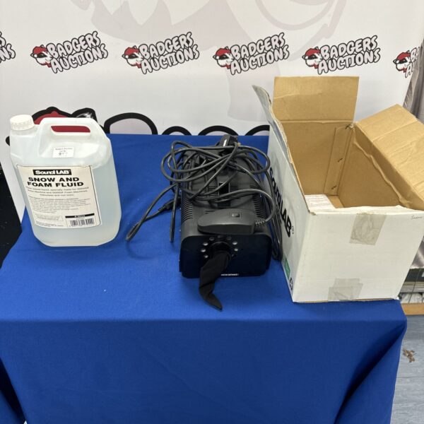 Soundlab snow foam machine with jug of liquid for party effects.