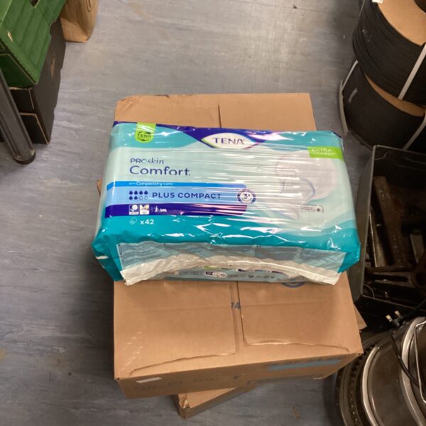 Two boxes of Tena Proskin comfort pads for incontinence protection.