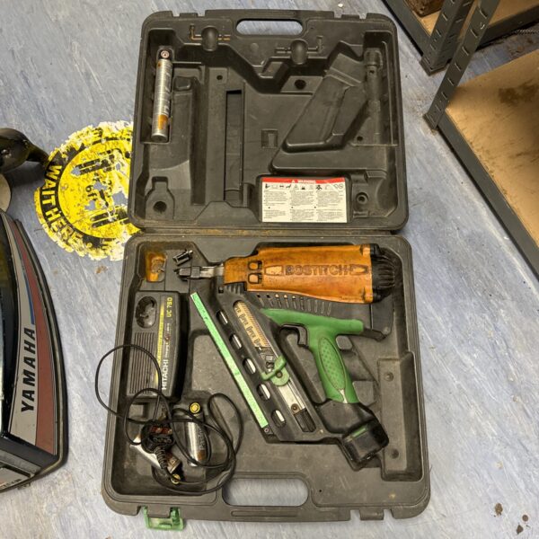 Bostitch cordless staple gun in open carrying case with charger.