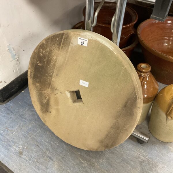 Weathered antique grindstone, 51cm diameter, ideal for collectors.